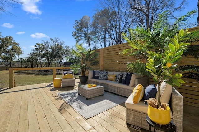 wooden terrace with outdoor lounge area