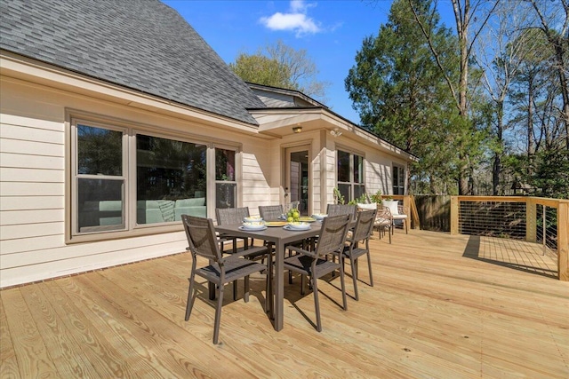 wooden terrace featuring outdoor dining area