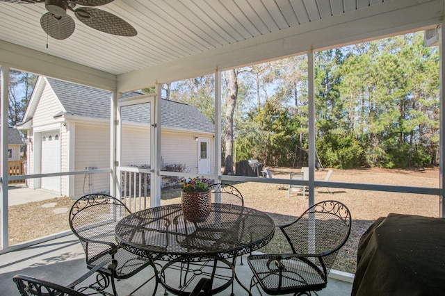 sunroom with a ceiling fan and plenty of natural light