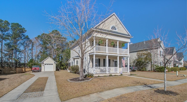 greek revival house with a porch, a balcony, a garage, an outdoor structure, and concrete driveway