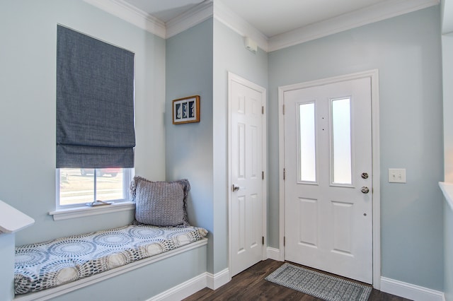 foyer with dark wood-style floors, crown molding, and baseboards