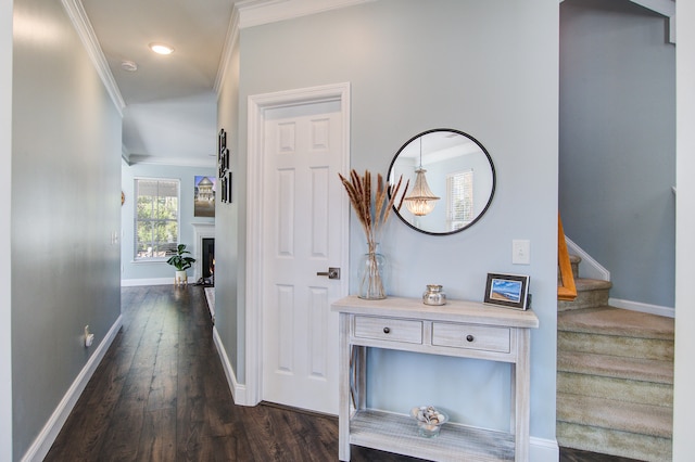 hallway featuring recessed lighting, baseboards, stairs, ornamental molding, and dark wood finished floors