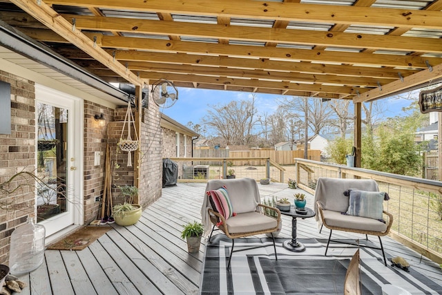 deck with a fenced backyard