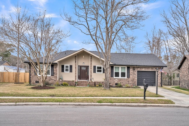 ranch-style home featuring a front lawn, fence, concrete driveway, an attached garage, and brick siding