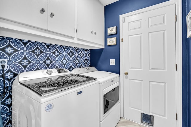 laundry area with cabinet space and washer and dryer