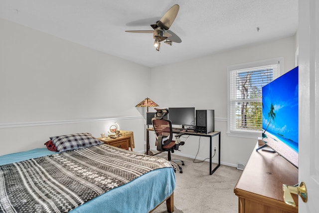 bedroom with baseboards, light colored carpet, and ceiling fan