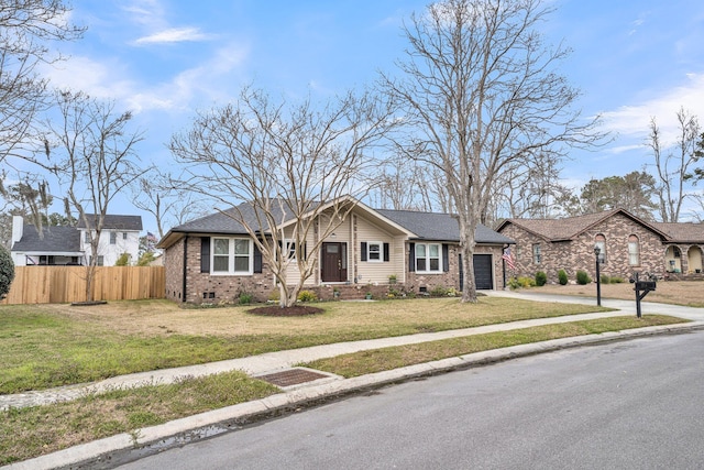 ranch-style home featuring fence, a front lawn, a garage, crawl space, and brick siding