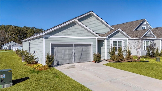 view of front of house with a front yard and a garage