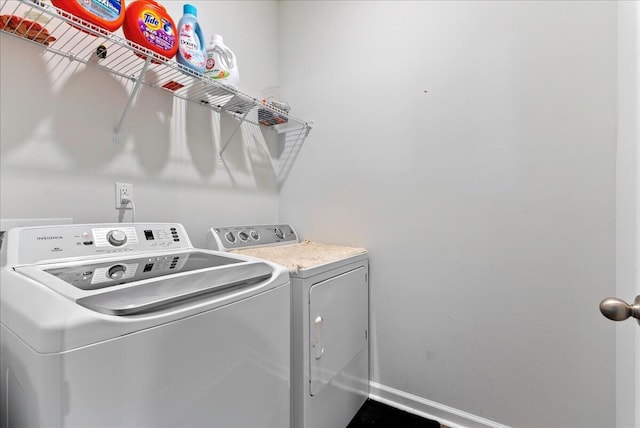 laundry area featuring washing machine and clothes dryer