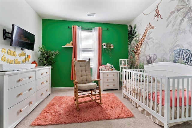 carpeted bedroom with a crib