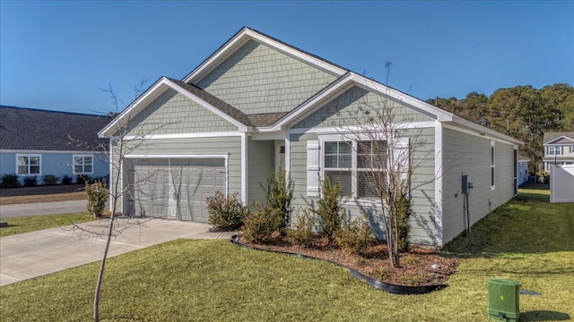 view of front facade with a front yard and a garage