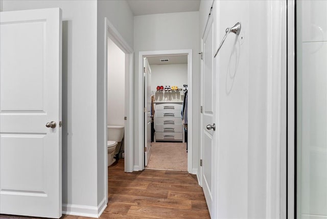 hallway with dark wood-type flooring