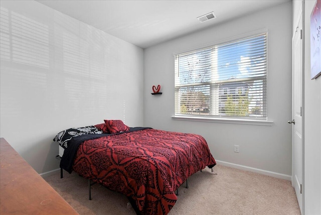 bedroom with light carpet