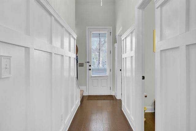 entryway with dark wood-style floors