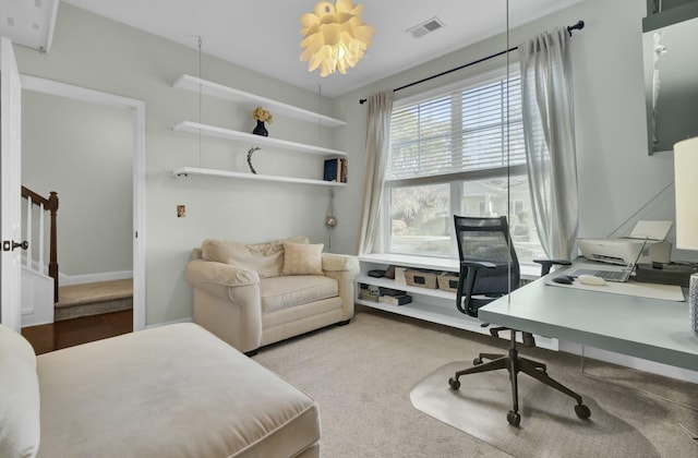 office space featuring visible vents and carpet flooring