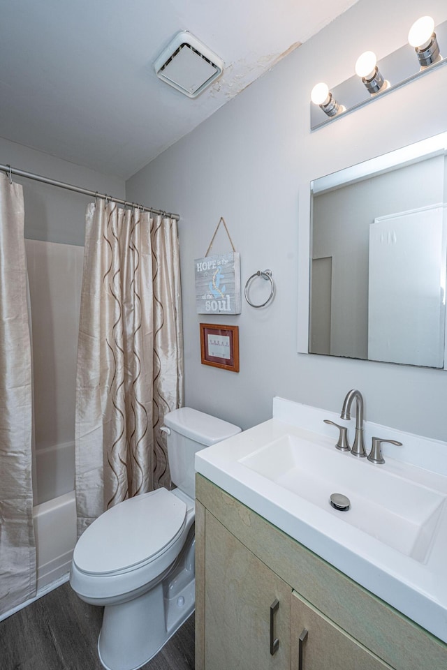 717 Temple Rd Unit B, Ladson, SC 29456 - bathroom with vanity, wood finished floors, toilet, and shower / bath combo with shower curtain