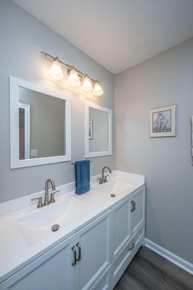 717 Temple Rd Unit B, Ladson, SC 29456 - bathroom featuring double vanity, wood finished floors, and baseboards