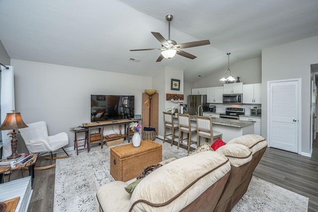 717 Temple Rd Unit B, Ladson, SC 29456 - living area featuring wood finished floors, lofted ceiling, baseboards, and a ceiling fan