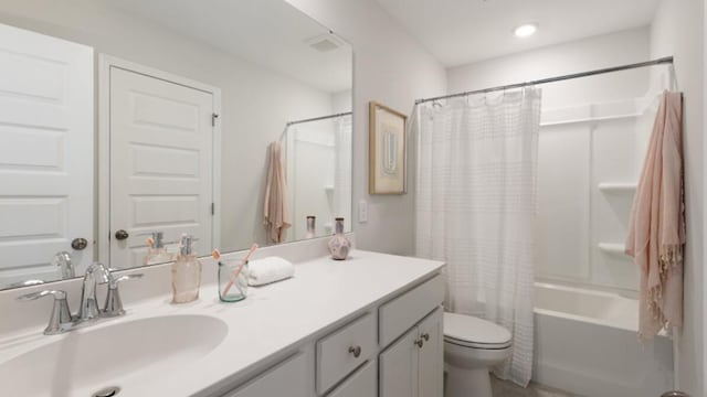 full bathroom with vanity, toilet, and shower / bath combination with curtain