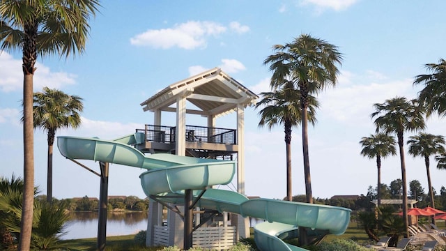 view of jungle gym with a water view