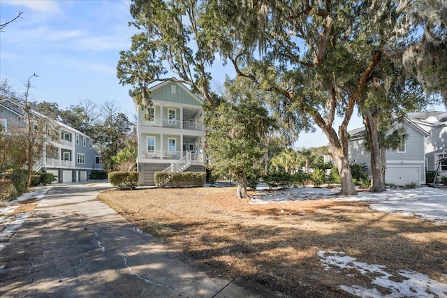 view of front of property featuring a garage and covered porch