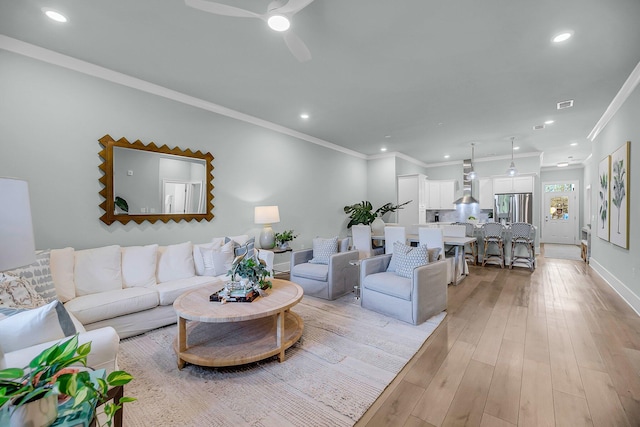 7416 Indigo Palms Way, Johns Island, SC 29455 - living area featuring recessed lighting, light wood-style flooring, ceiling fan, crown molding, and baseboards
