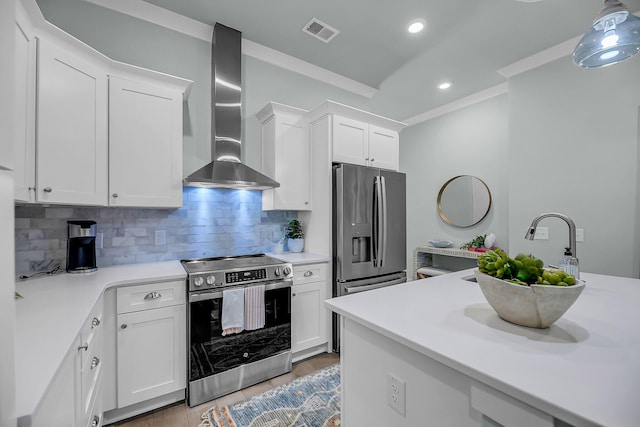 7416 Indigo Palms Way, Johns Island, SC 29455 - kitchen with appliances with stainless steel finishes, wall chimney exhaust hood, light countertops, white cabinetry, and ornamental molding