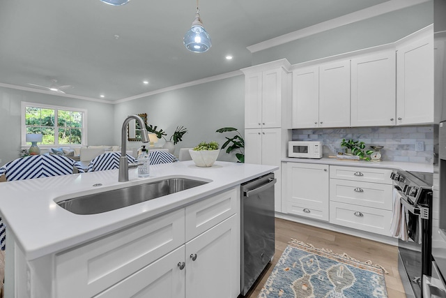 7416 Indigo Palms Way, Johns Island, SC 29455 - kitchen with a sink, range, ornamental molding, stainless steel dishwasher, and light countertops
