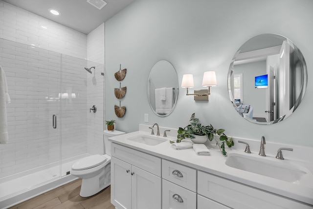 7416 Indigo Palms Way, Johns Island, SC 29455 - full bath with a stall shower, double vanity, toilet, wood finished floors, and recessed lighting