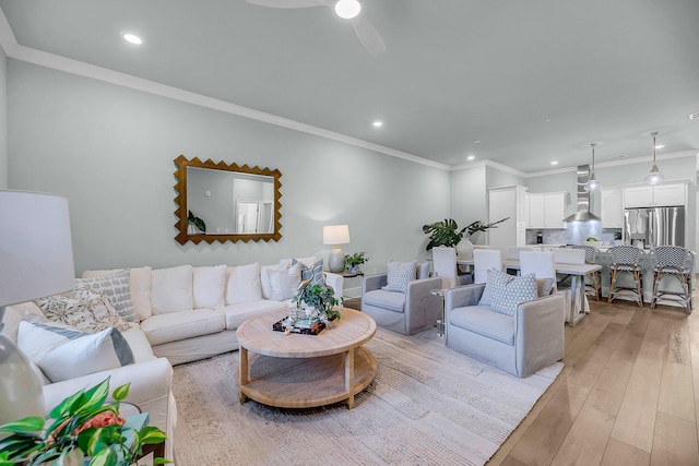7416 Indigo Palms Way, Johns Island, SC 29455 - living area with crown molding, light wood-style flooring, recessed lighting, and ceiling fan