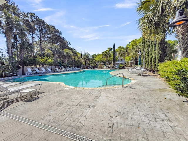7416 Indigo Palms Way, Johns Island, SC 29455 - community pool featuring a patio and view of scattered trees