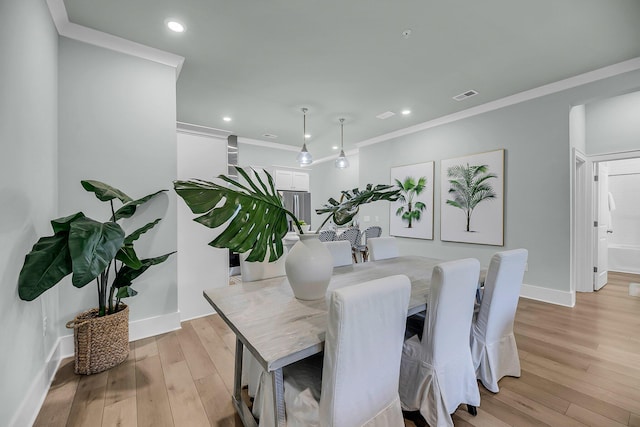 7416 Indigo Palms Way, Johns Island, SC 29455 - dining area featuring light wood-type flooring, ornamental molding, recessed lighting, and baseboards