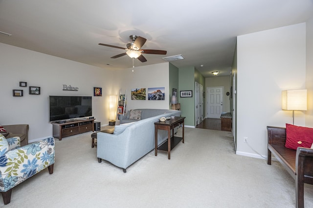 carpeted living room featuring ceiling fan