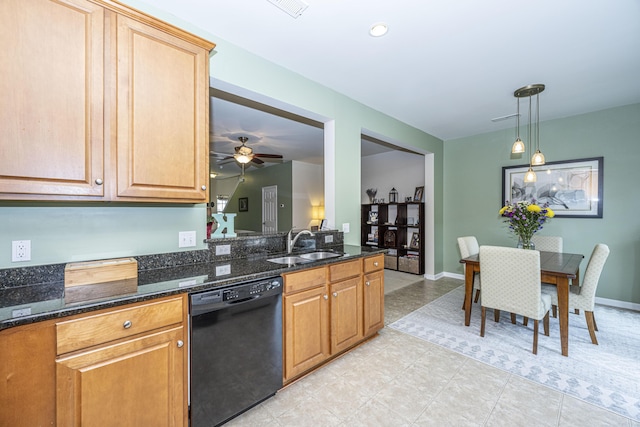 kitchen with pendant lighting, sink, ceiling fan, dark stone countertops, and black dishwasher