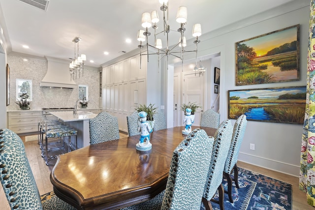 dining room featuring recessed lighting, visible vents, light wood-type flooring, and a chandelier