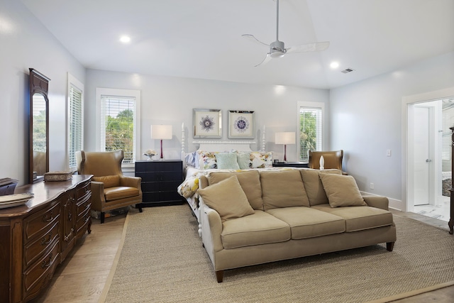 bedroom with light wood-style floors, multiple windows, recessed lighting, and visible vents