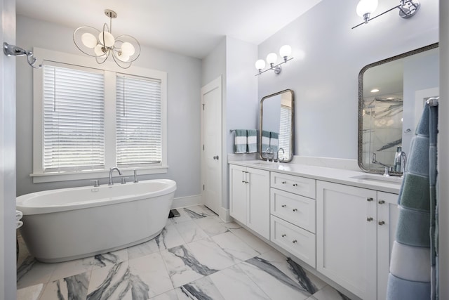 bathroom featuring double vanity, a sink, marble finish floor, a notable chandelier, and a marble finish shower
