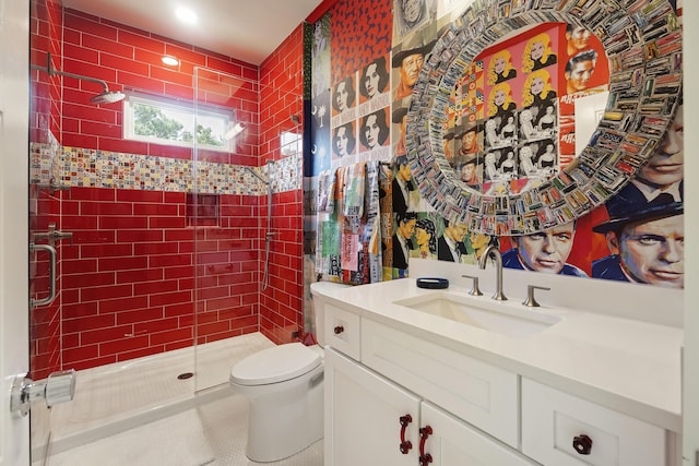 full bathroom featuring vanity, tile patterned flooring, toilet, and a shower stall