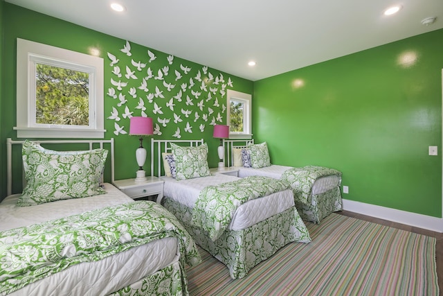 bedroom featuring baseboards and recessed lighting
