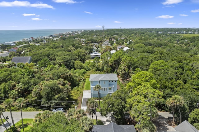 birds eye view of property with a wooded view