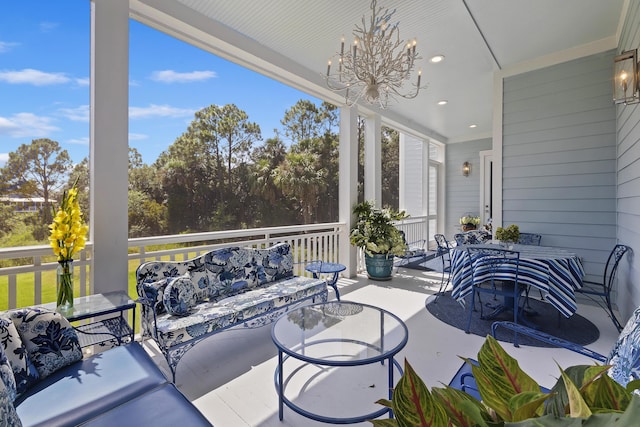 sunroom featuring a notable chandelier