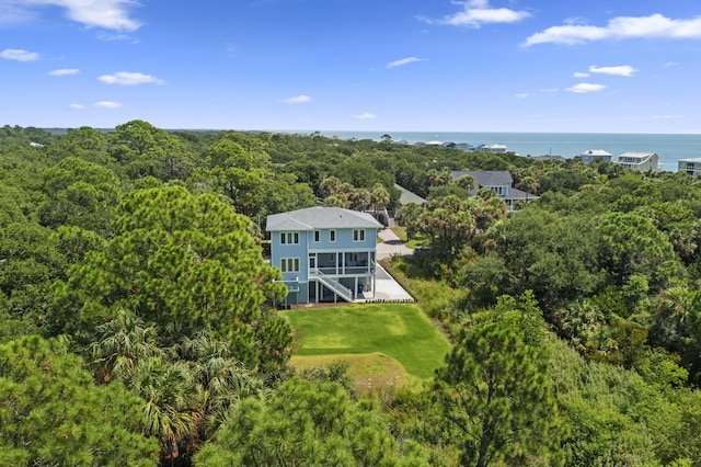 aerial view featuring a water view and a view of trees
