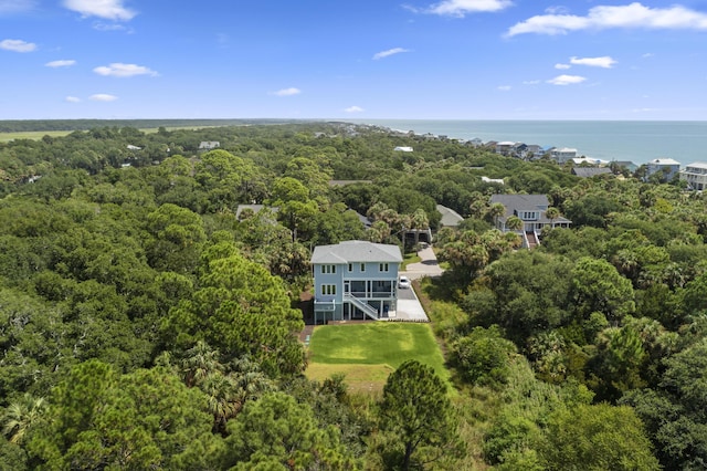 bird's eye view with a water view and a view of trees