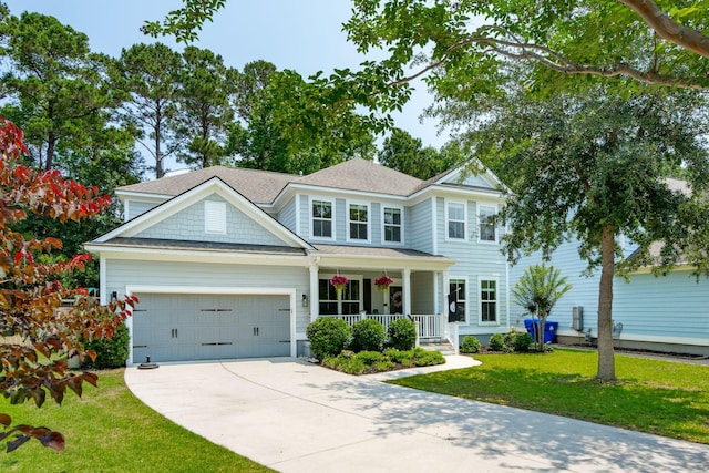 1164 Sharpestowne Ct, Mount Pleasant, SC 29466 - view of front of property featuring covered porch, an attached garage, driveway, a front yard, and roof with shingles