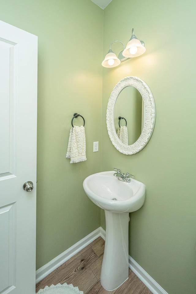 bathroom featuring baseboards and wood finished floors