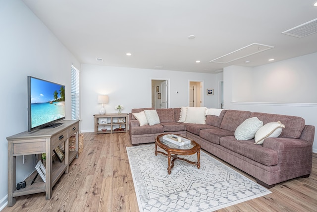 living area featuring attic access, recessed lighting, visible vents, and light wood-style flooring