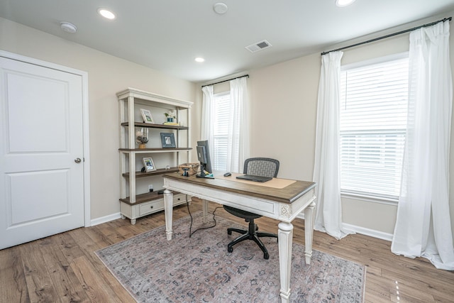 office area featuring recessed lighting, baseboards, visible vents, and light wood finished floors