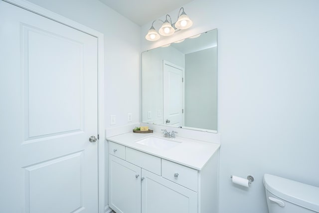 half bath with toilet and vanity