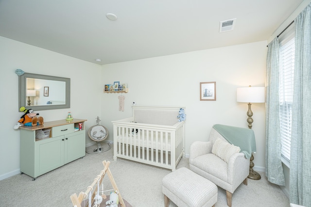 bedroom featuring light carpet, baseboards, and visible vents