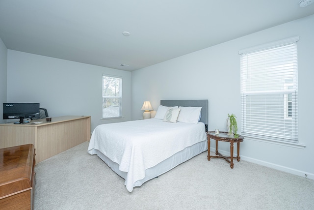 bedroom with carpet and baseboards